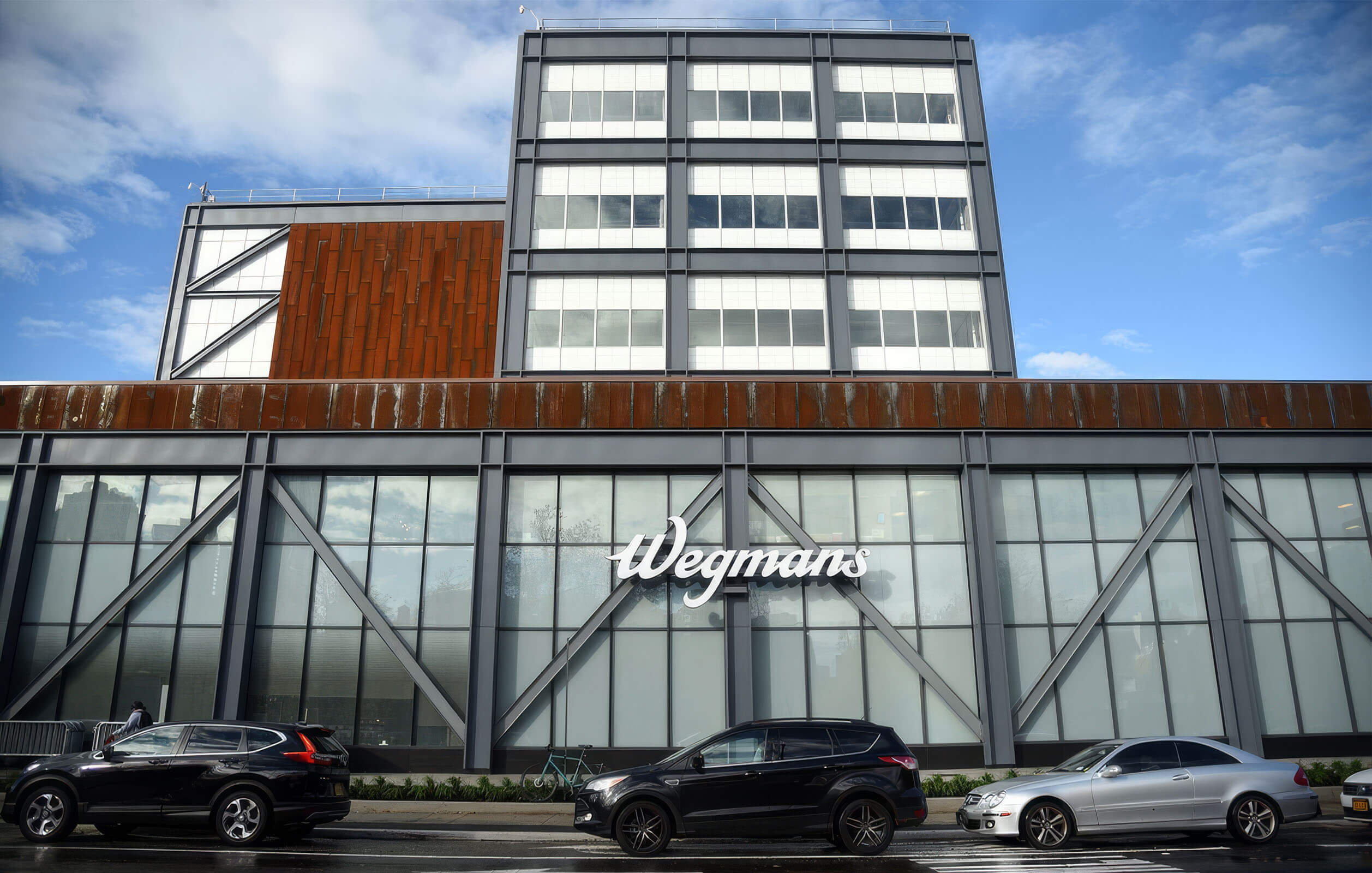 Cars driving past the Wegmans inside the Admirals Row development