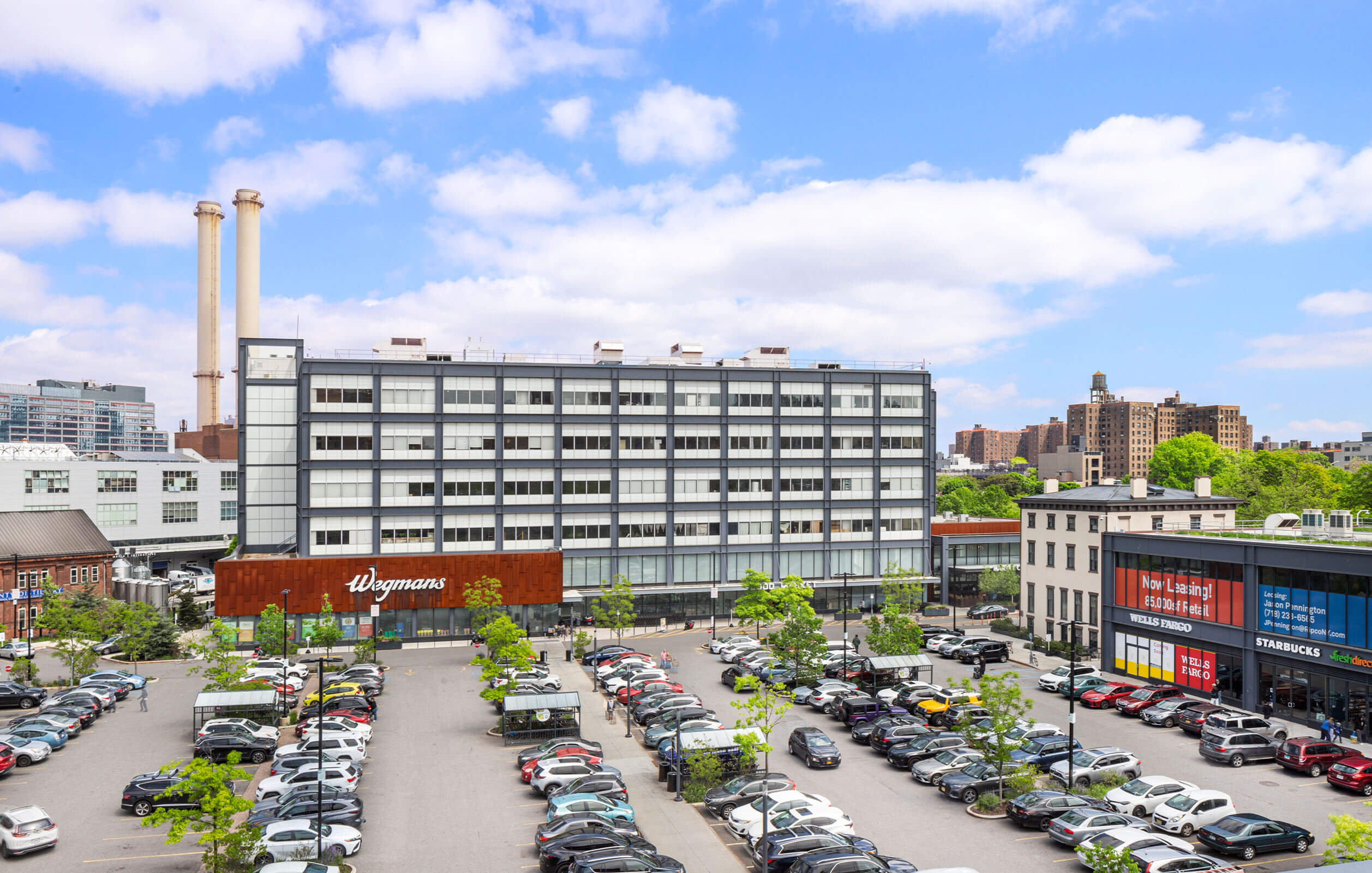 Overhead view of the surface parking lot adjacent to the Wegmans and light industrial building built by Steiner NYC