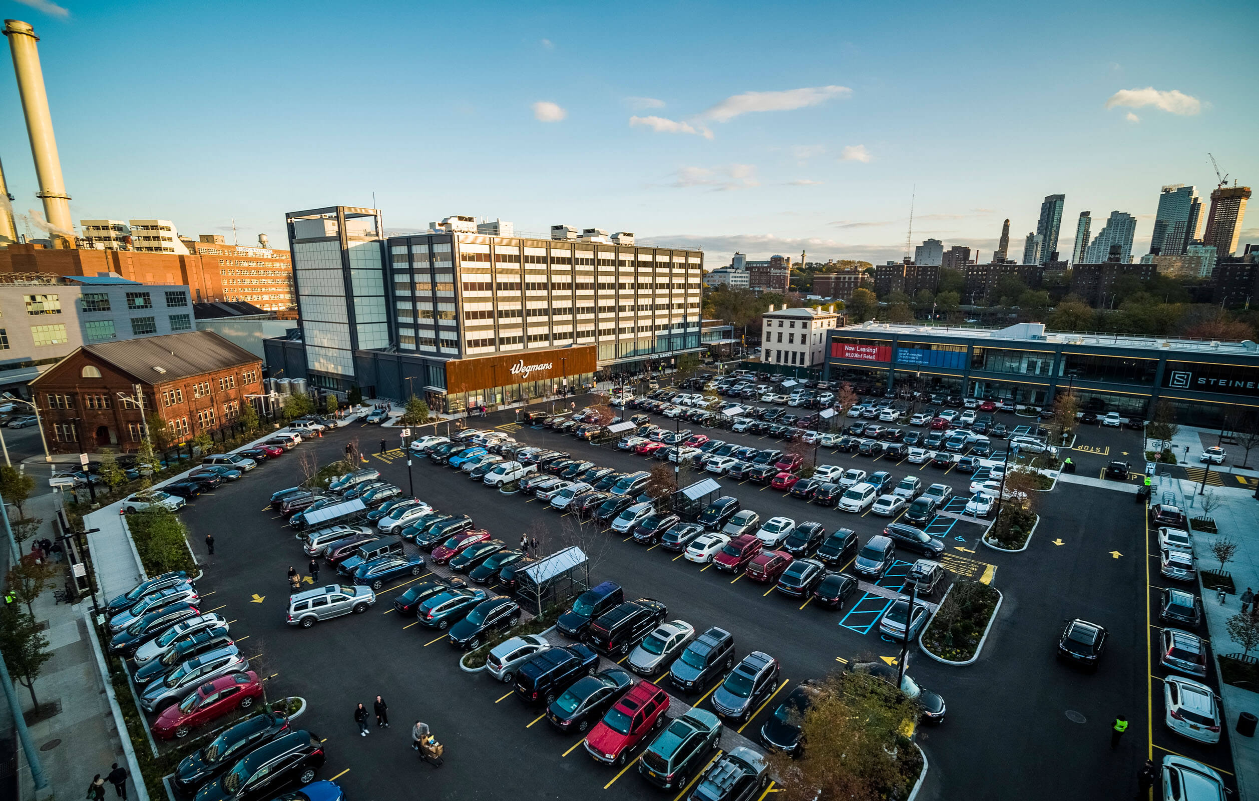 Overhead view of the surface parking lot adjacent to the Wegmans and light industrial building built by Steiner NYC