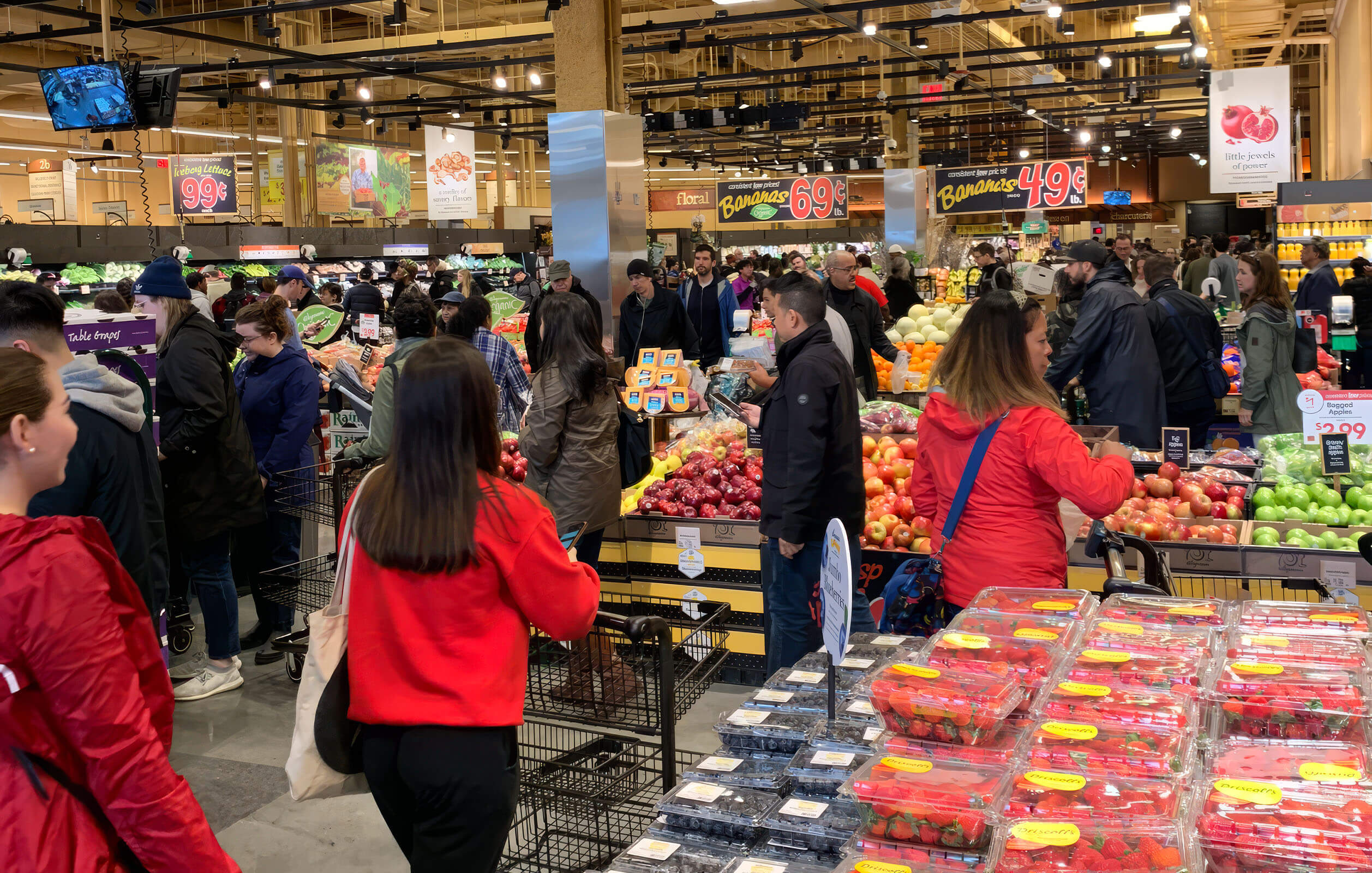 People shopping inside a Wegmans in the Brooklyn Navy Yard
