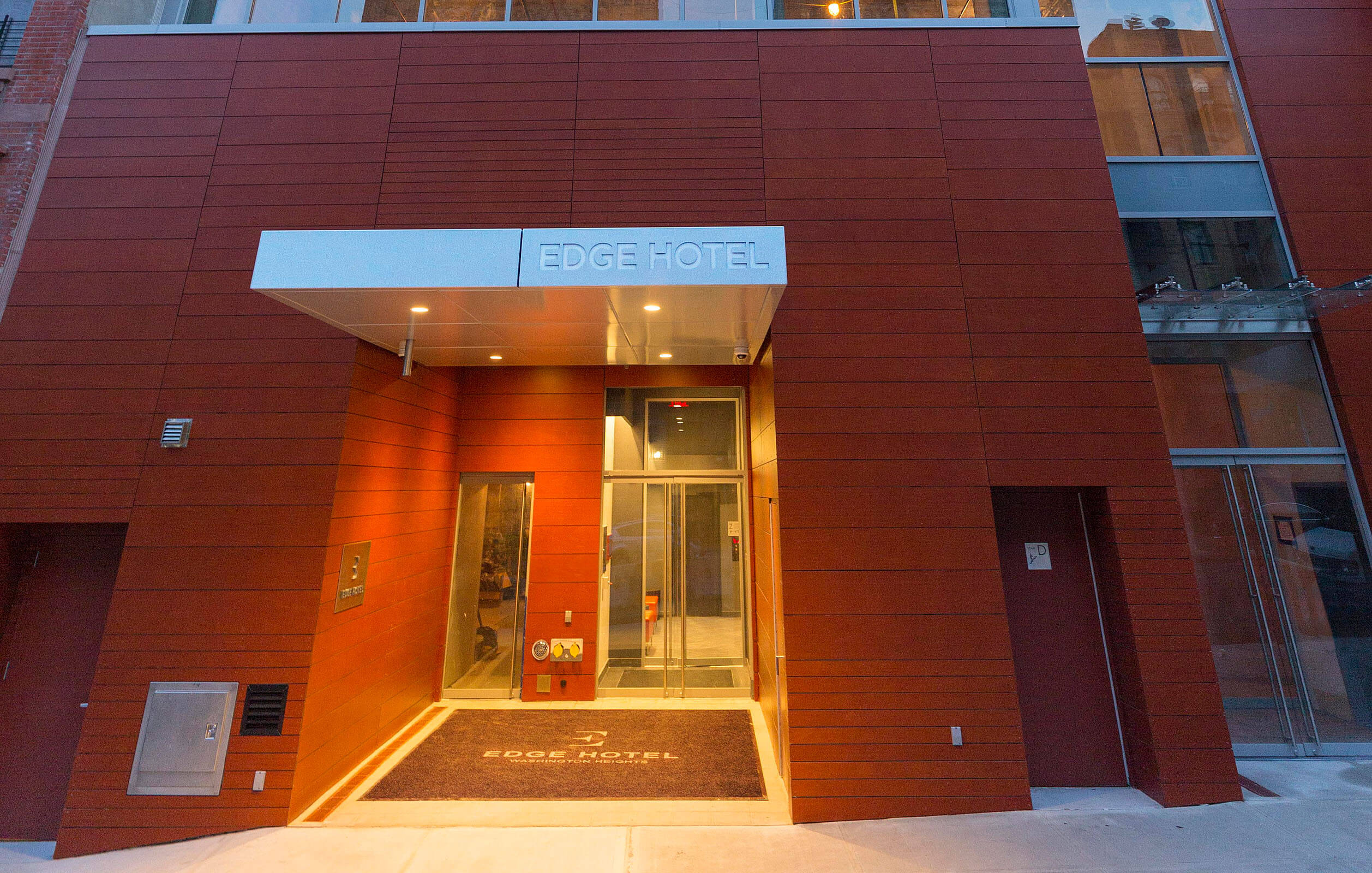Ground level view of entrance and seven story Edge Hotel