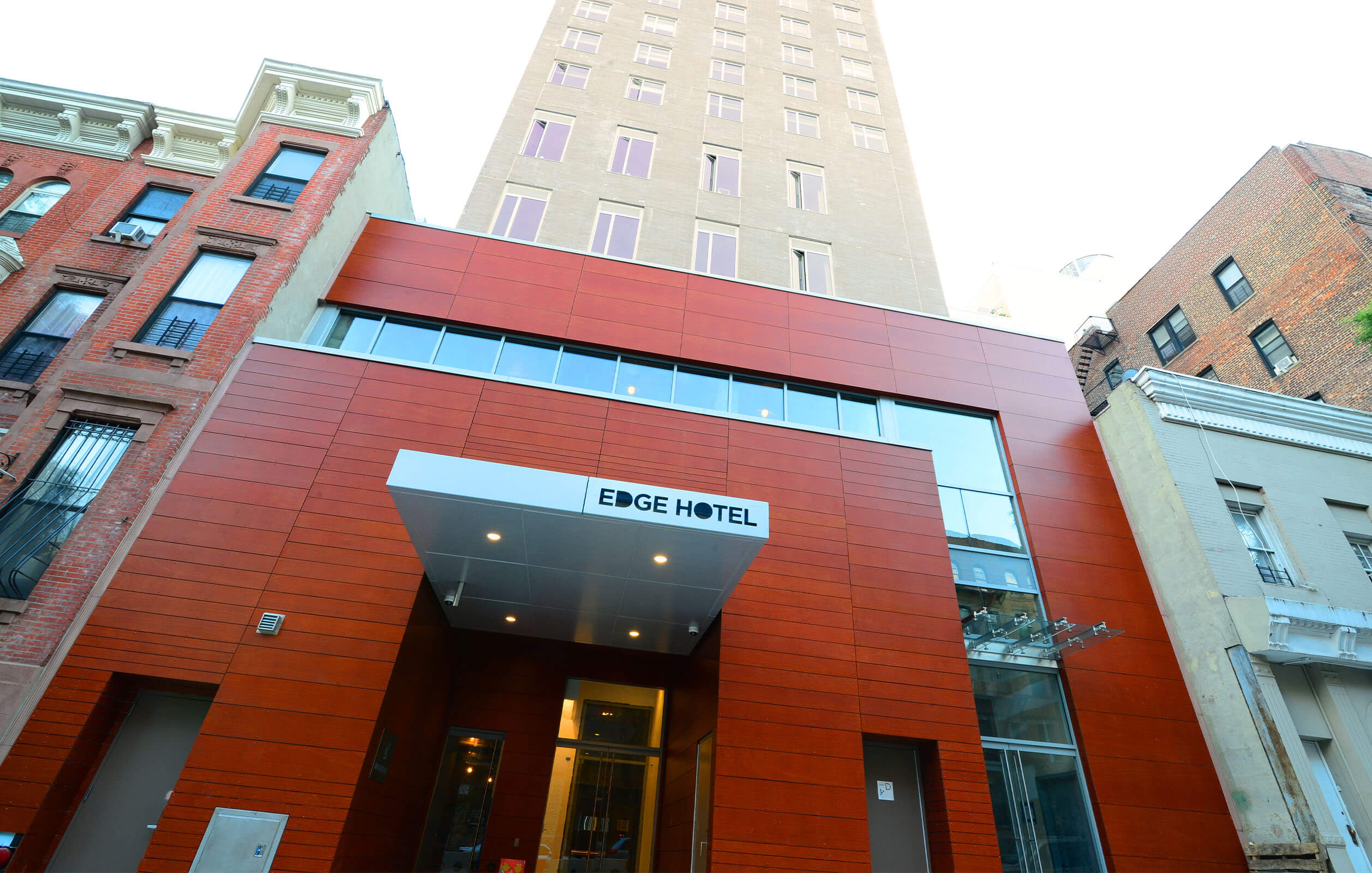 Ground level view of entrance and seven story Edge Hotel