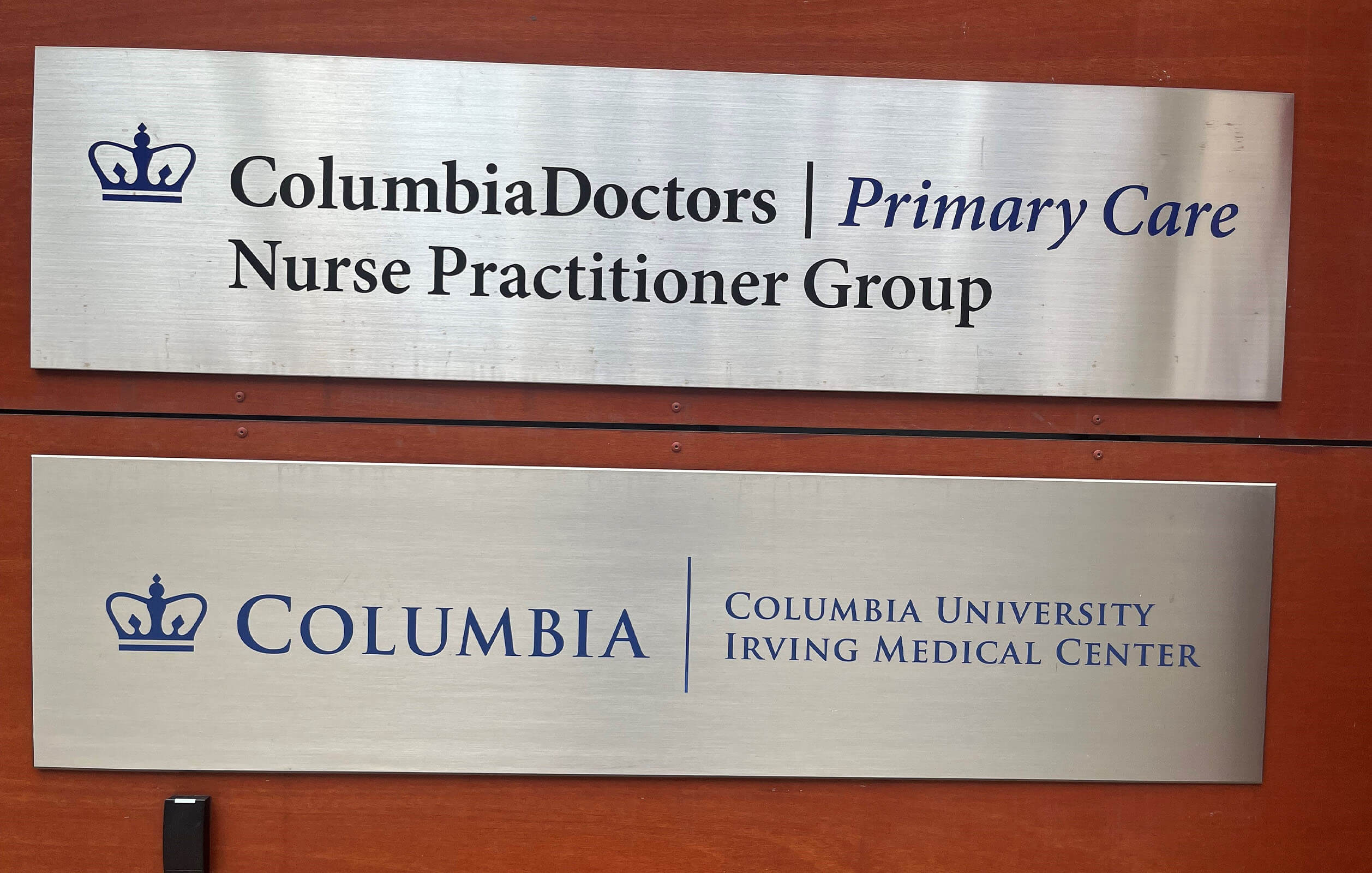 Signage of office tenants at Edge Property Group's mixed-use development in Washington Heights. Signage states the two tenants from Columbia University