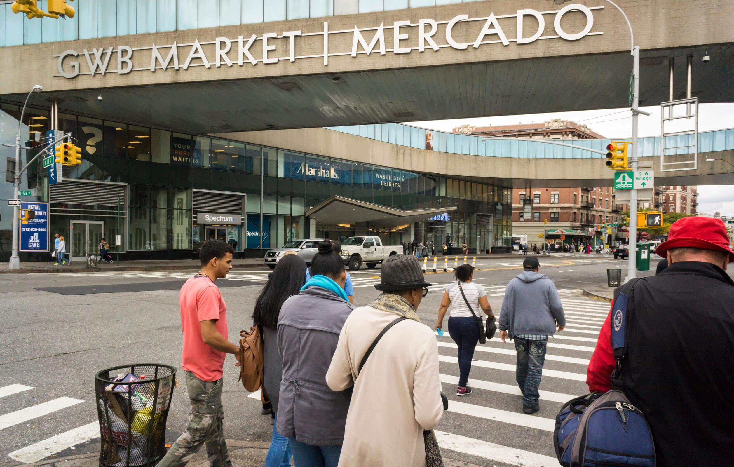 People walking into the GWB Market Mercado