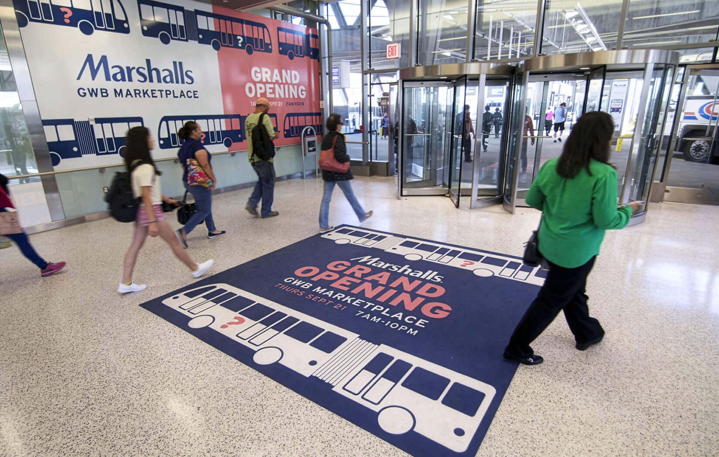 People walking past Marshalls at the George Washington Bridge Bus Station retail mall