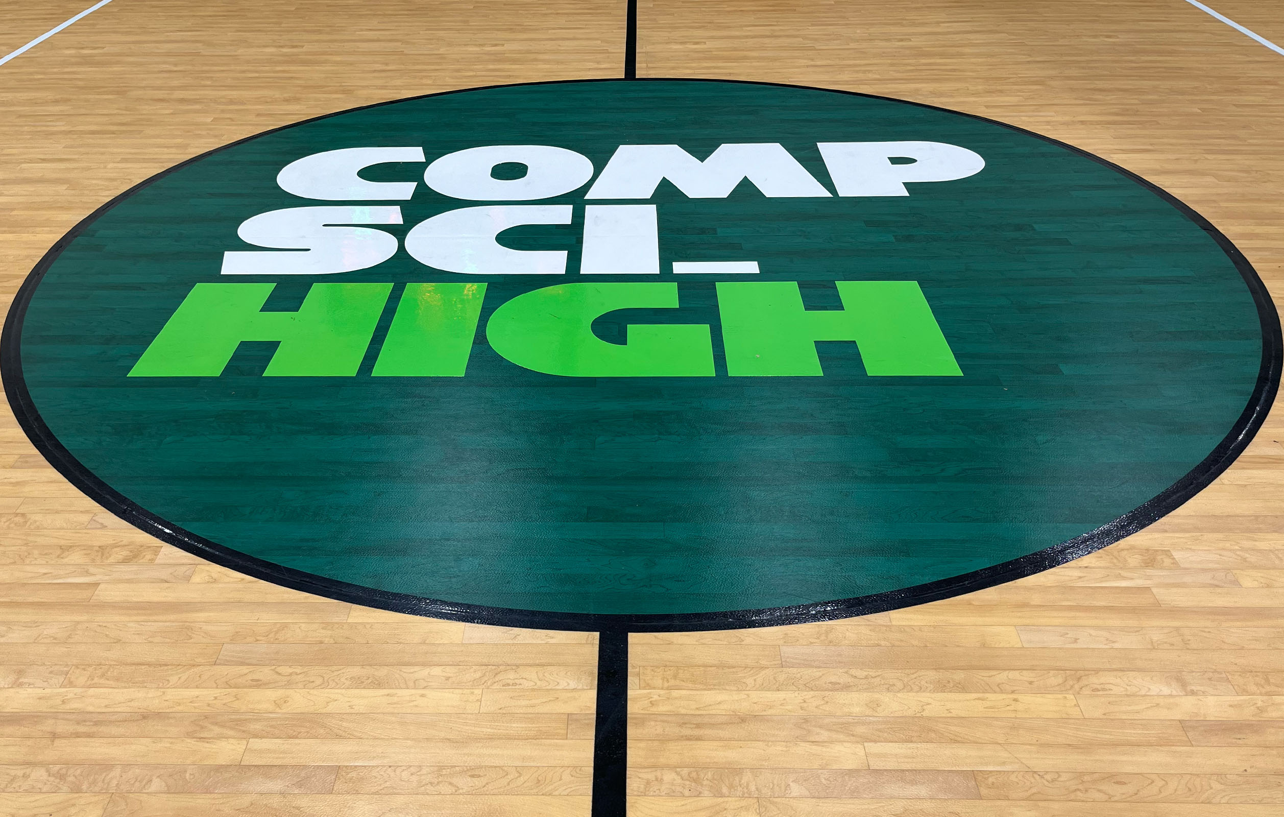 Comp Sci High logo at center court of school's new gymnasium