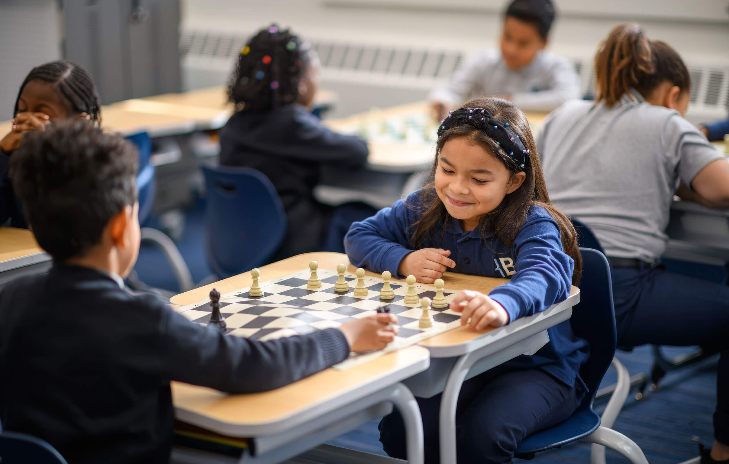 Students playing chess at Bold Charter School