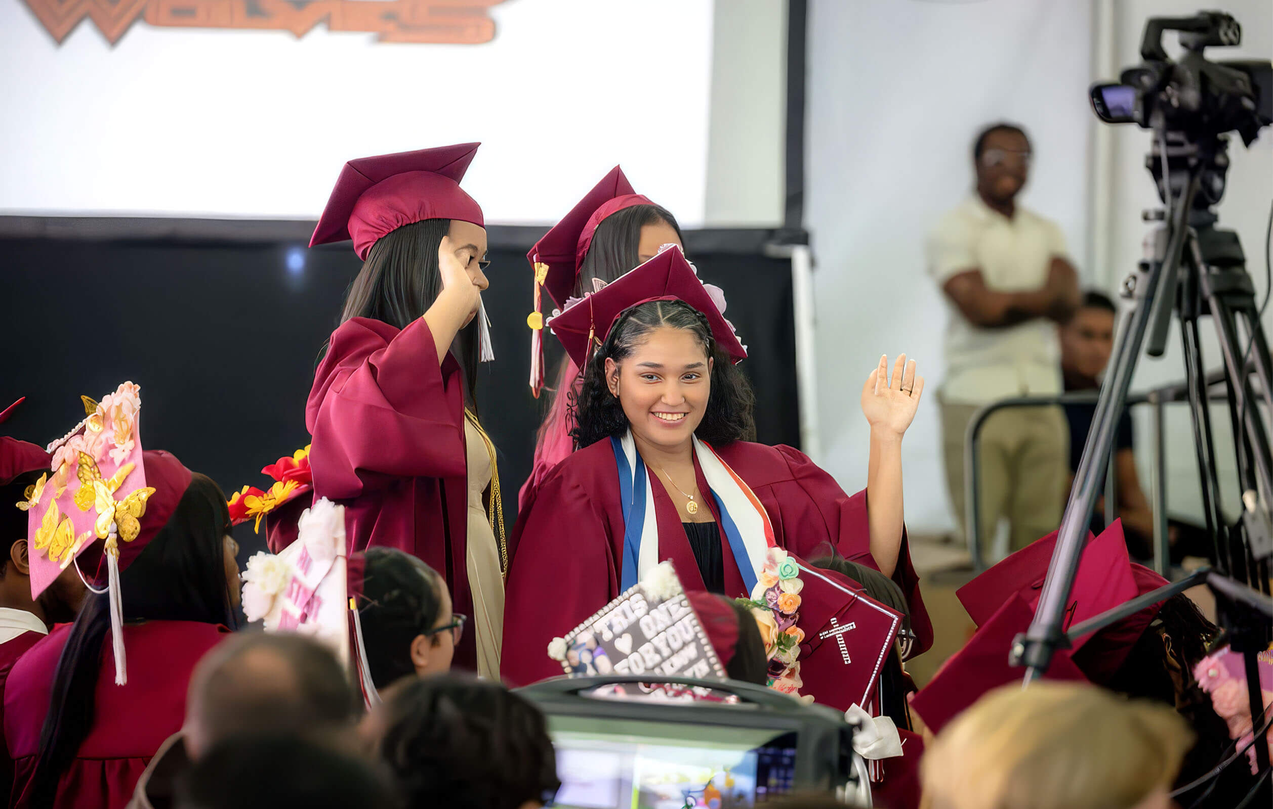 Students in graduation gowns at the graduation ceremony for the Charter High School for Law and Social Justice