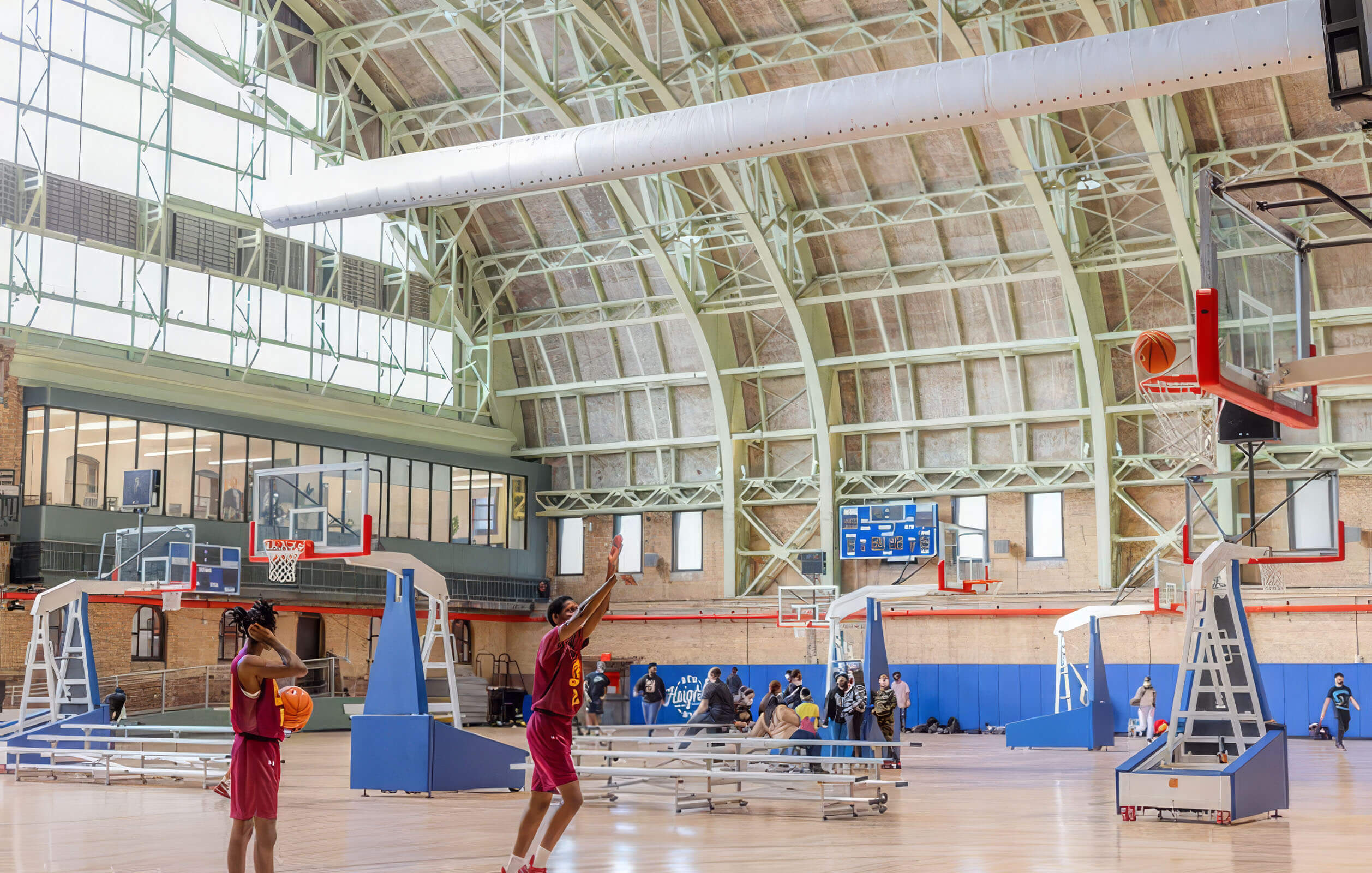 Players shooting on the basketball courts at the Major Owens Health & Wellness Community Center
