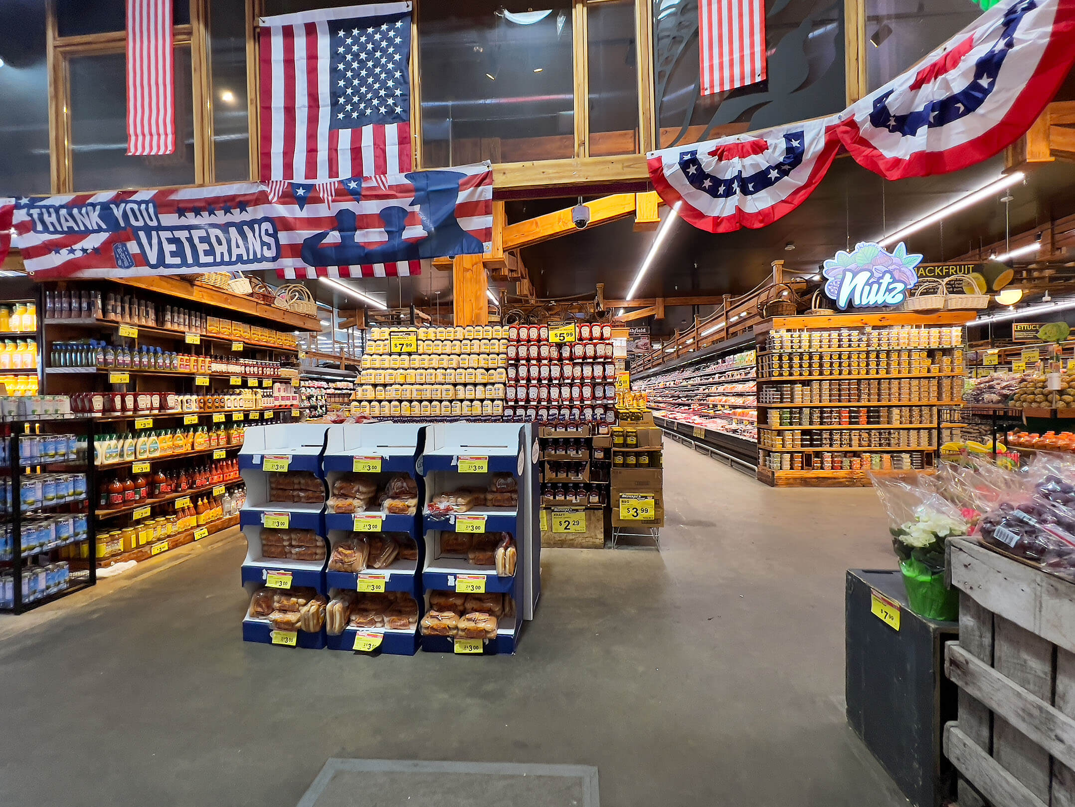 American flags surrounding aisles of food in Brooklyn's new Food Bazaar supermarket