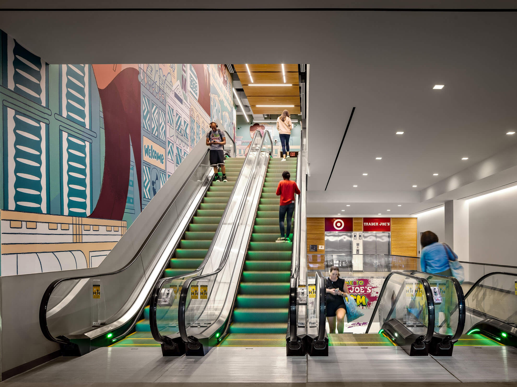 Escalators taking people up and down in the retail part of the National Urban League Empowerment Center