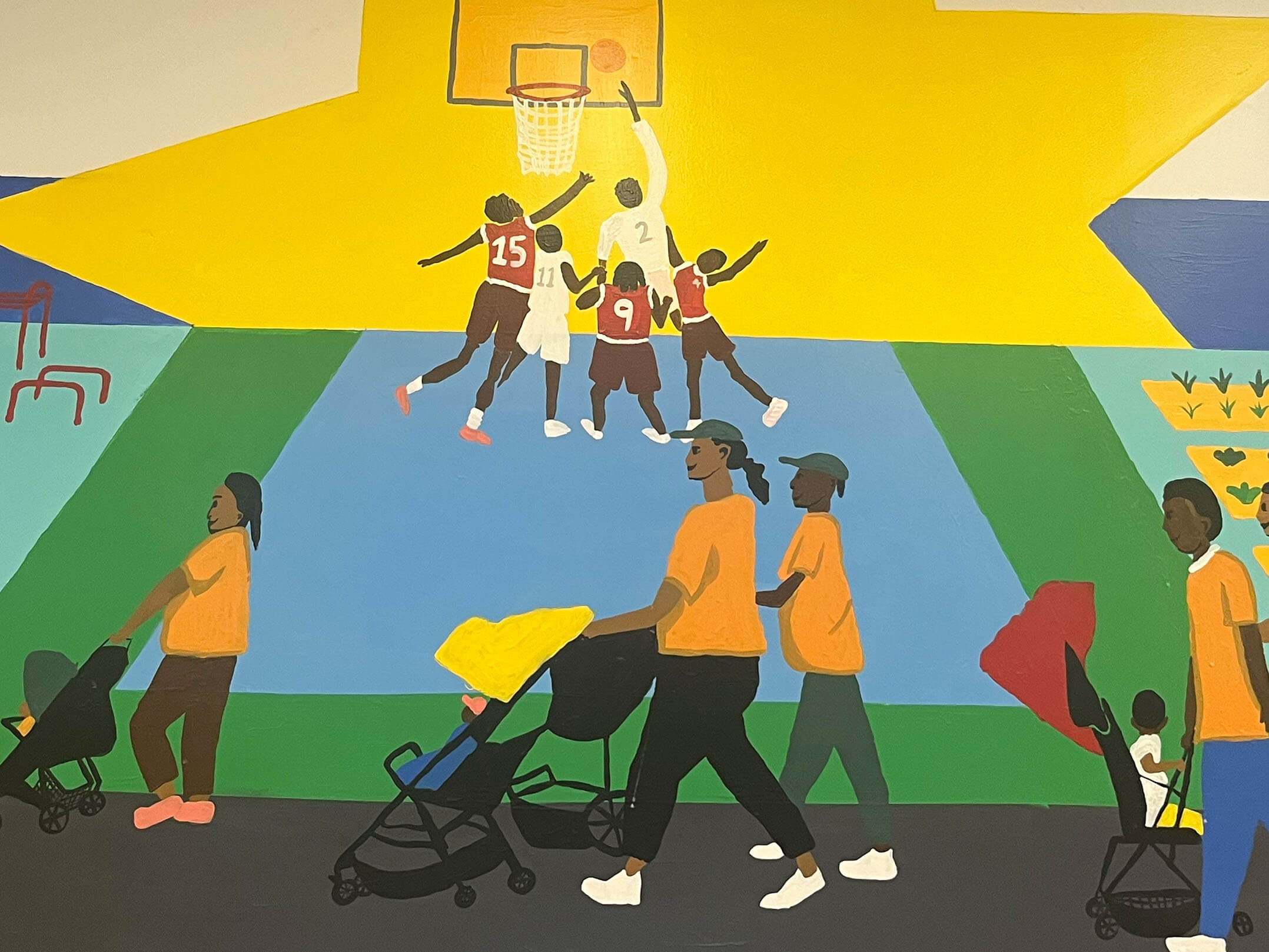 Murals showing mothers pushing baby strollers and kids playing basketball