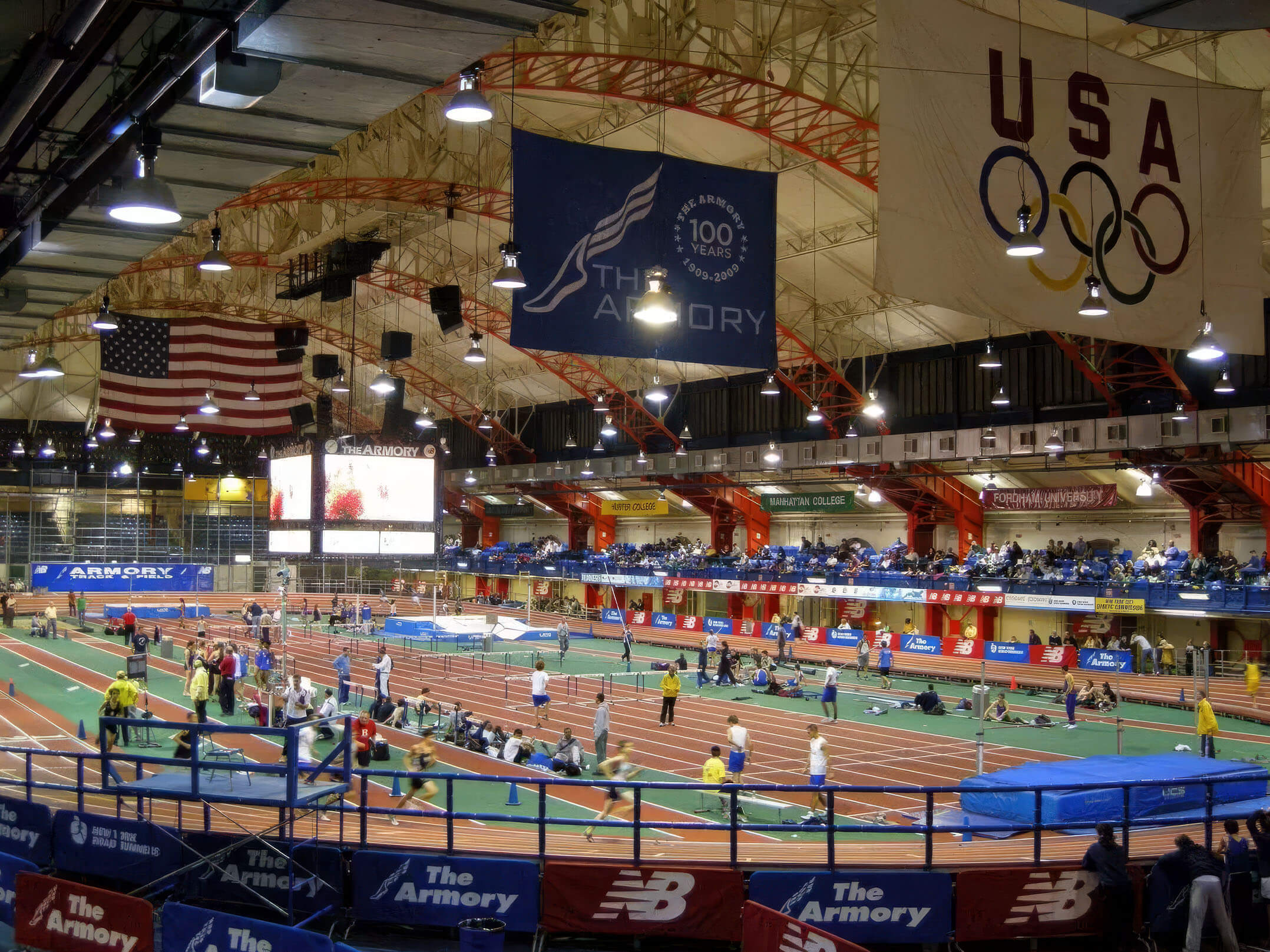 View of track meet being held at the Nike Track & Field Center at the Armory