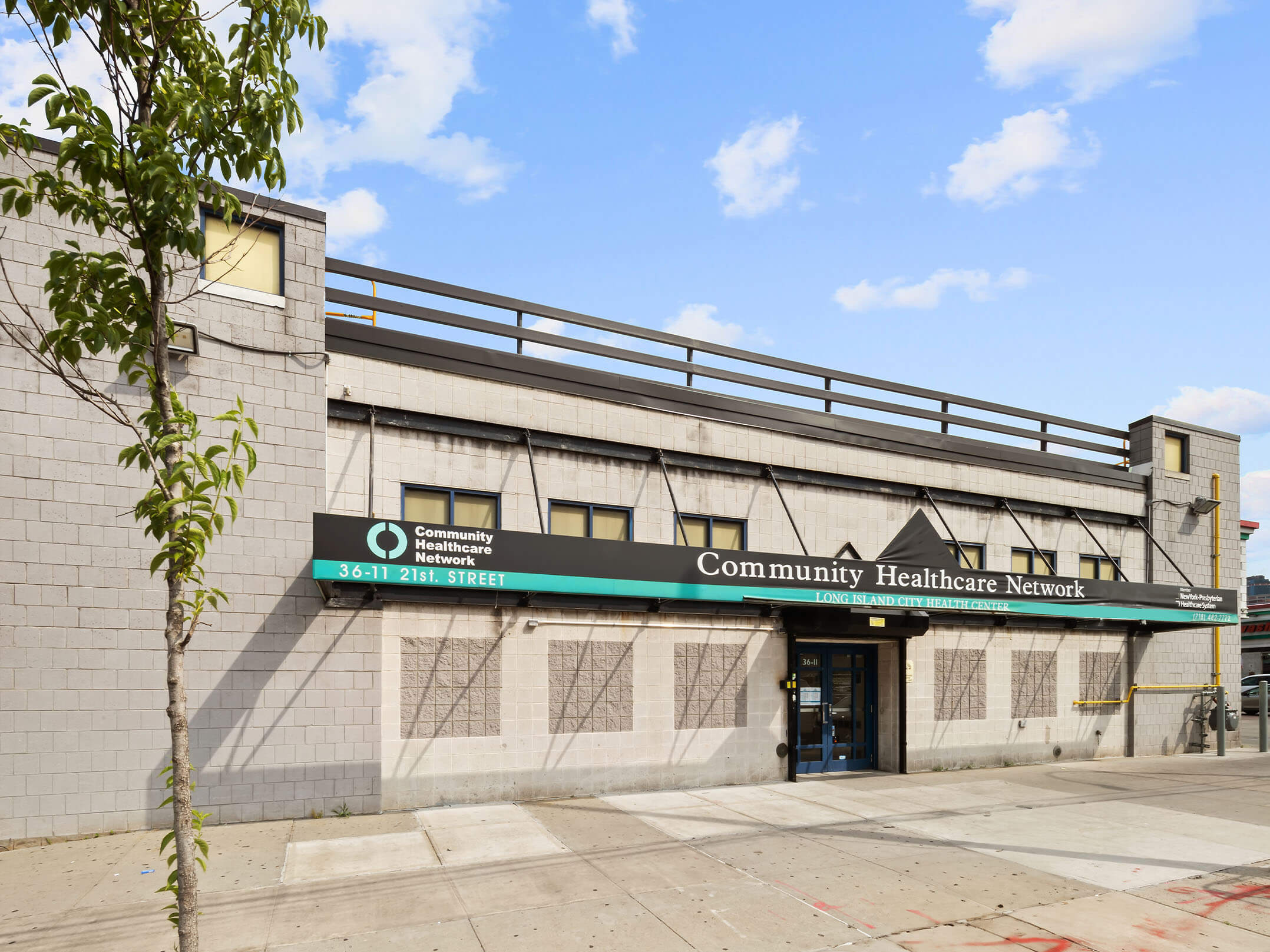Street-level view of the entrance of the Community Healthcare Network in Queens