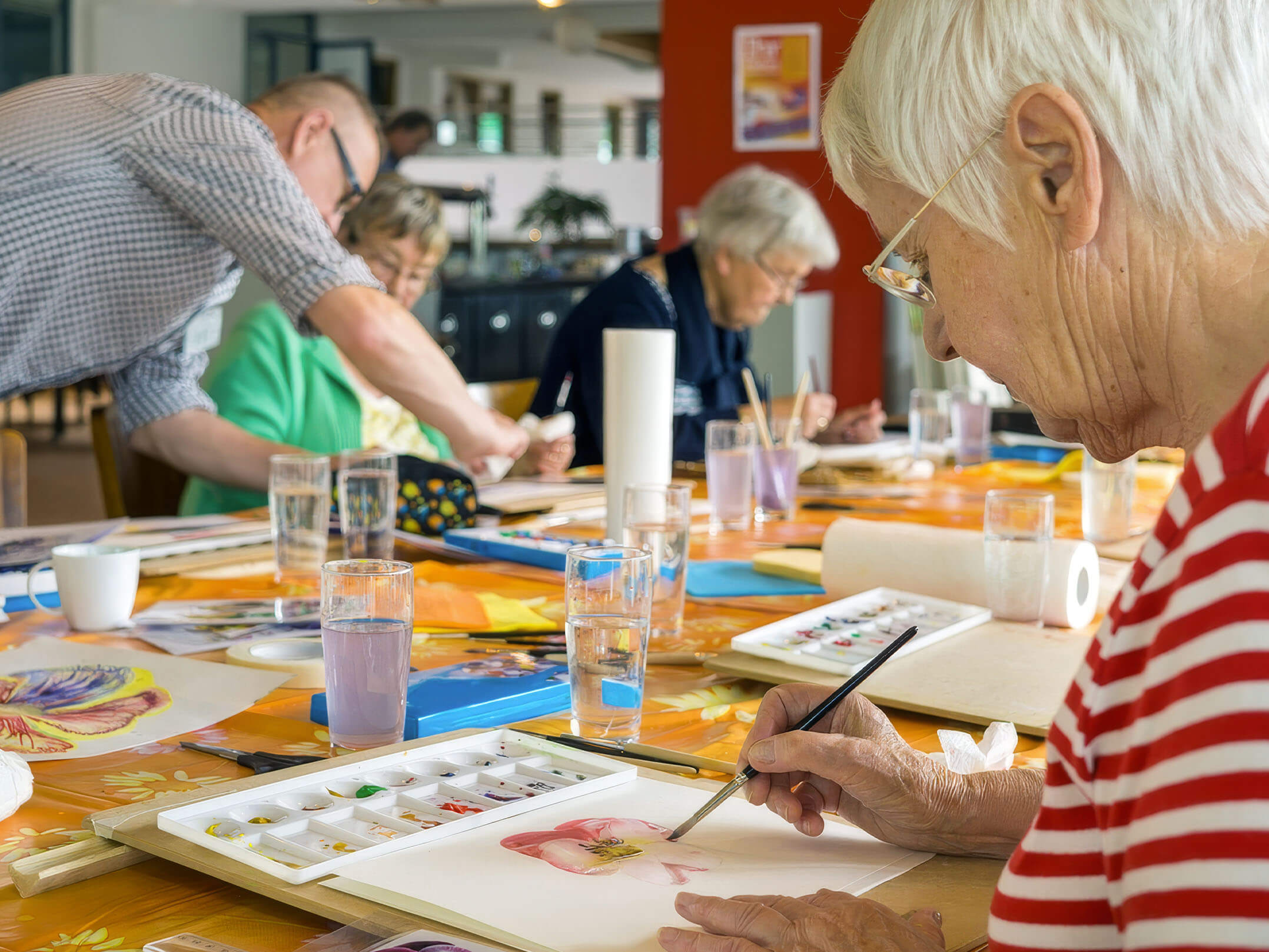 Senior citizens doing art work in of the Town Hall Foundation's community programs