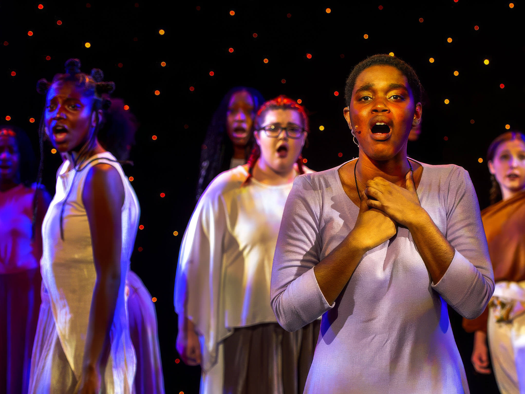 Young women singing on stage at the Town Hall Foundation's Repertory Company High School Theatre for the Arts