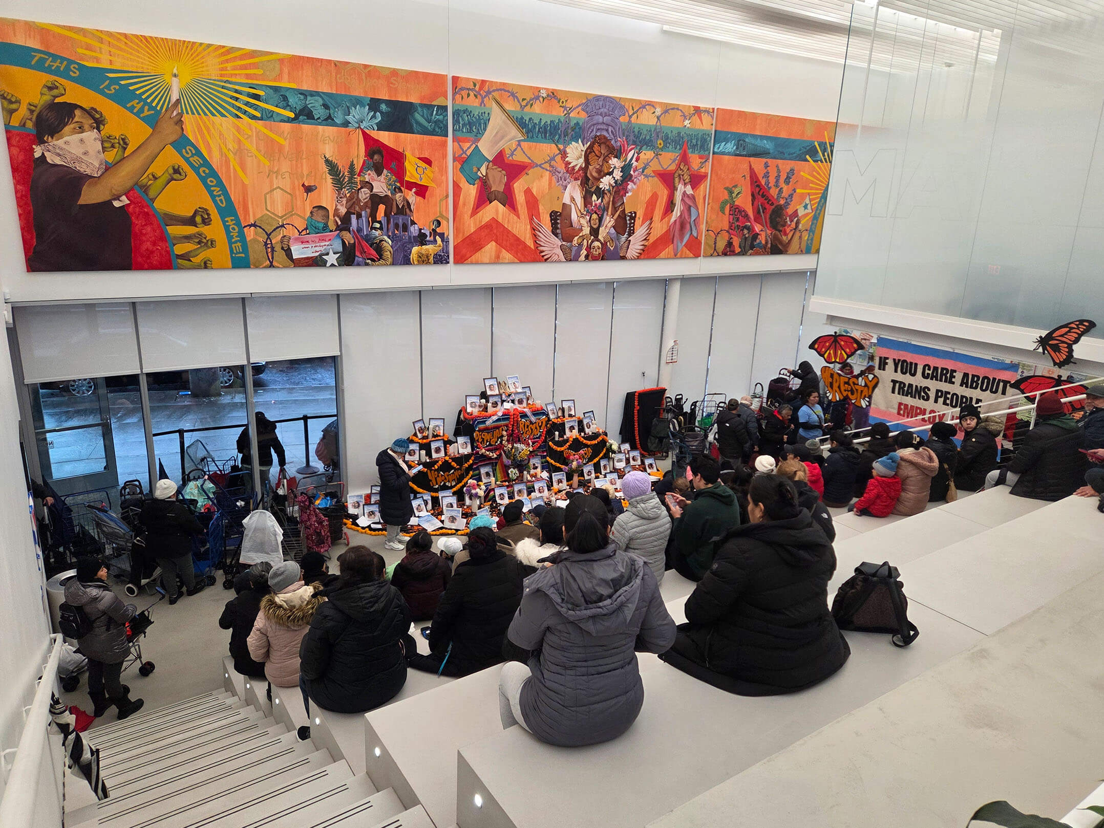 People sitting in event space at Make the Road New York's new 24,000 square foot community center in Queens