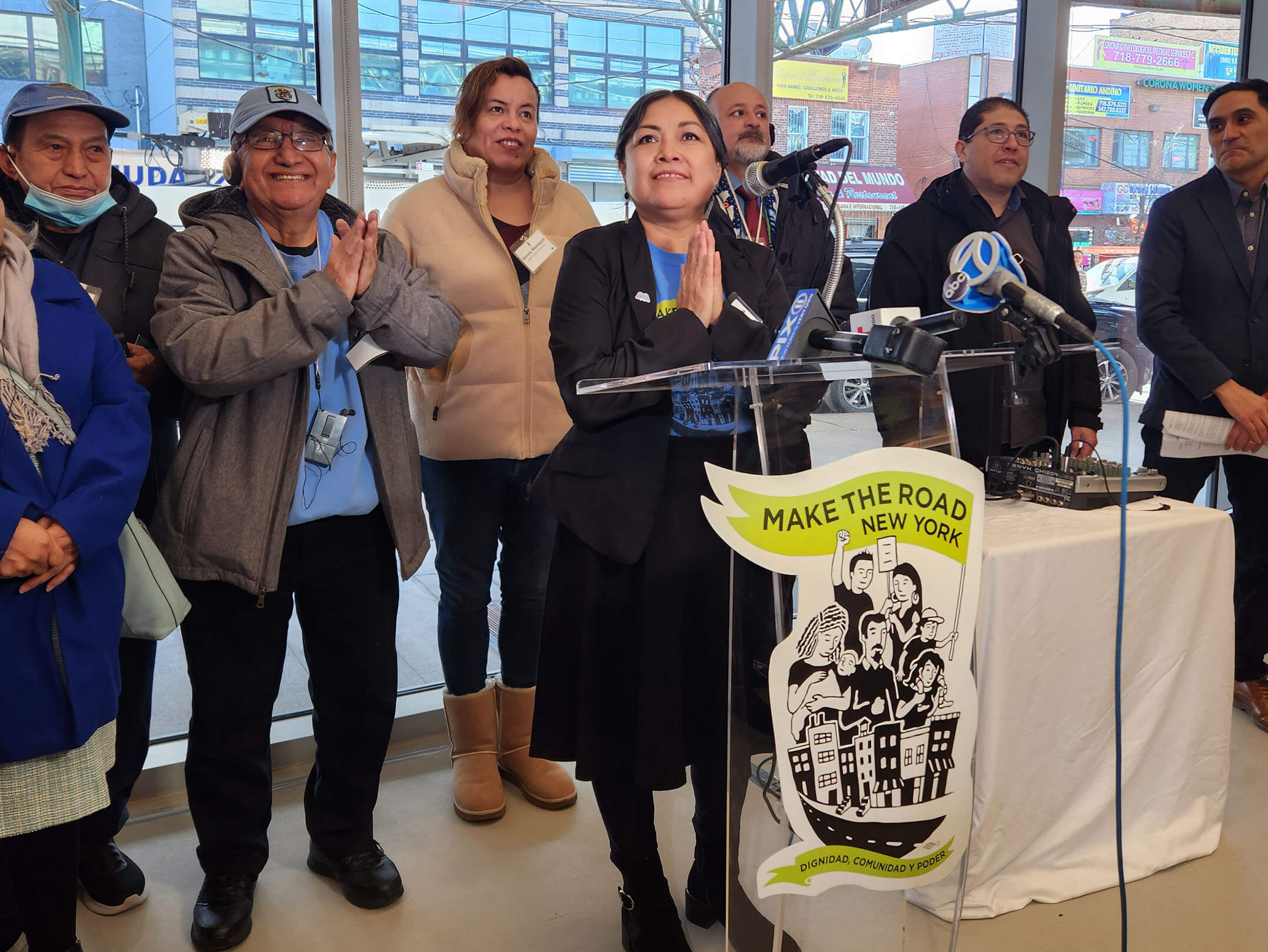 Woman speaking at ribbon cutting ceremony for the grand opening of Make the Road New York's new community center in Queens