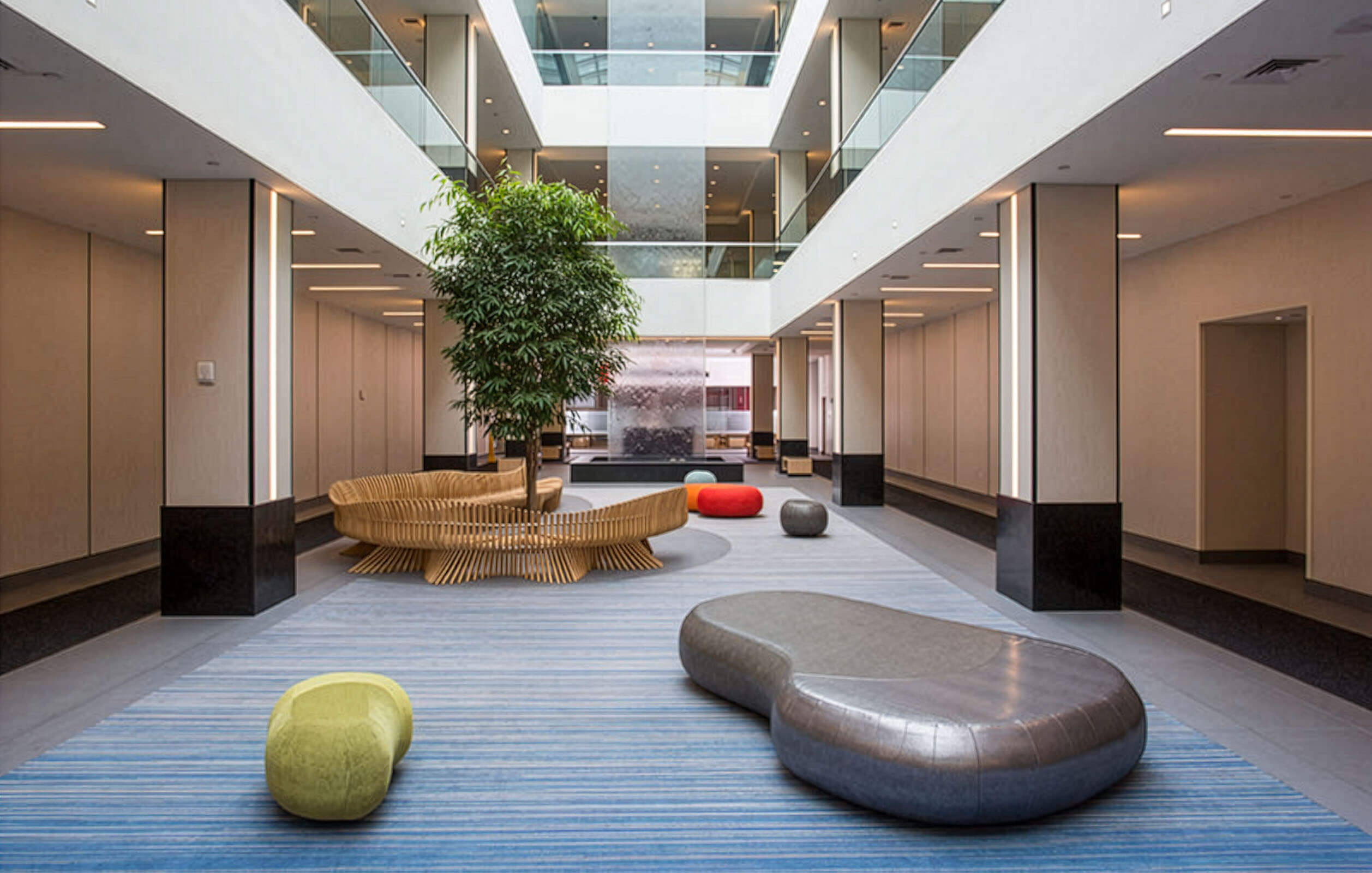 Modern seating and indoor plants surround the lobby area of the Metro Center Atrium's office complex