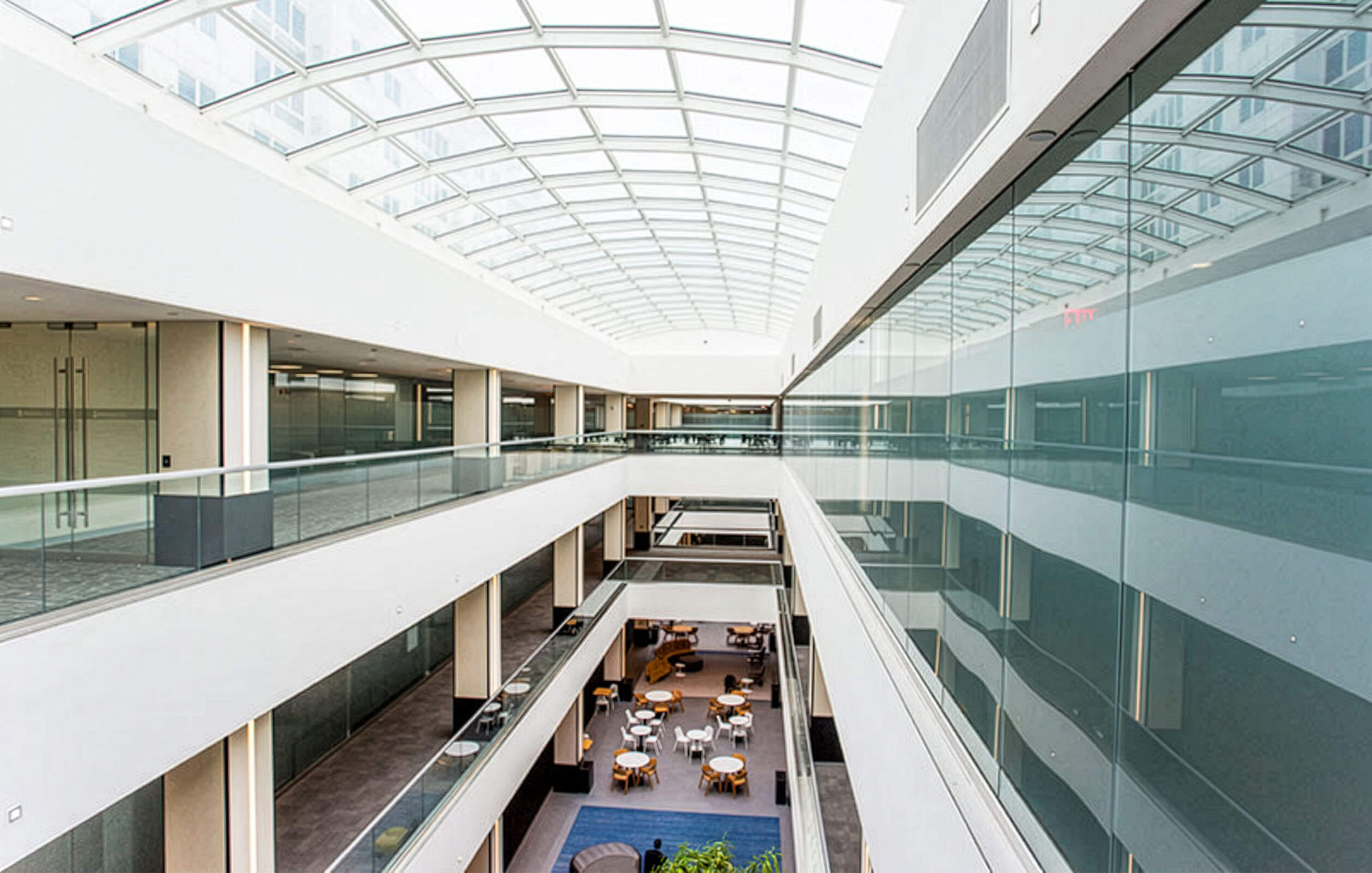 View of multi-level floors surrounded by glass atrium at the Metro Center Atrium's office complex