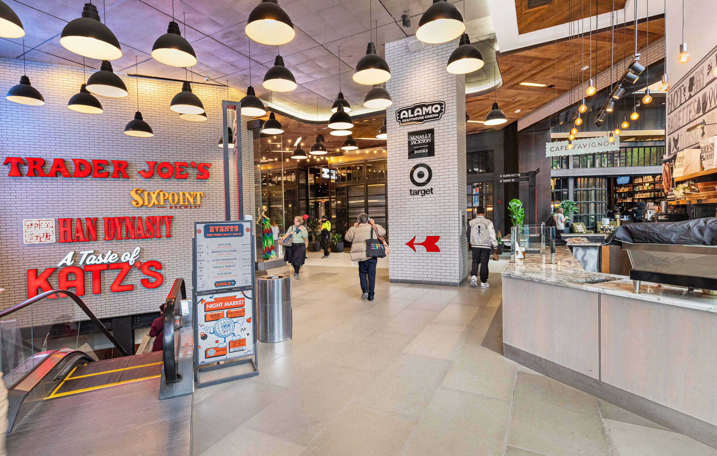 Entrance to the food court in the City Point mall showing signs for Trader Joe's and Katz's.
