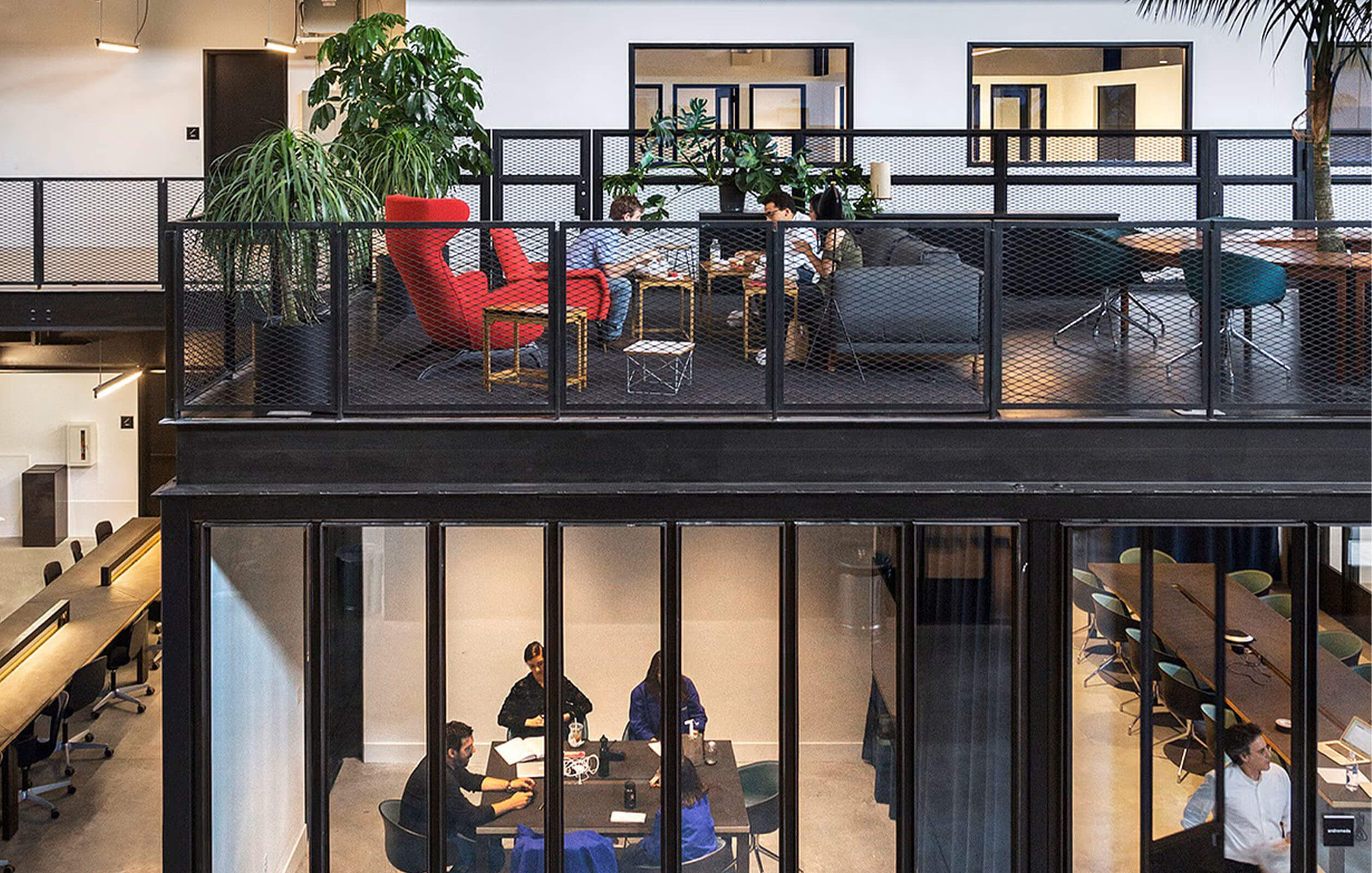 People working in lowerlevel conference room at Newlab complex in the Brookyn Navy Yard
